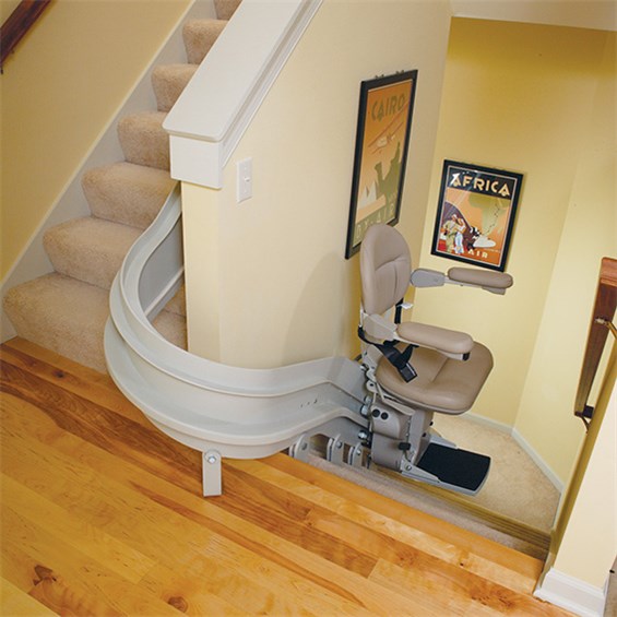 a curved stairchair in a house with wood floors in Cherry Hill